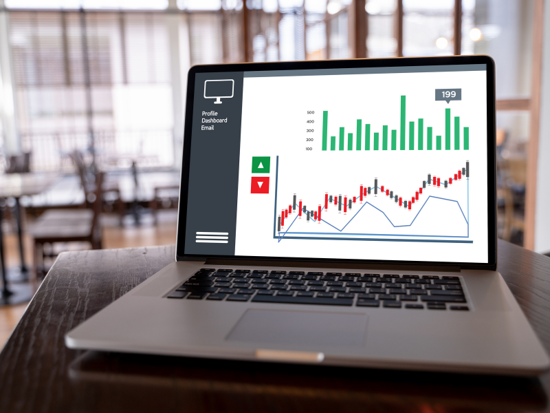 Open laptop displaying a financial growth and profitability dashboard.